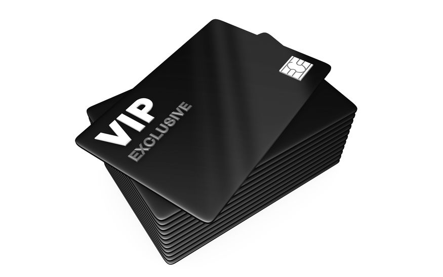 A stack of black vip exclusive cards with silver lettering and a chip visible on the top card.